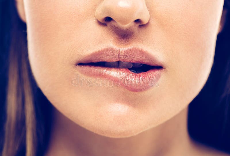 Woman bite lips close up face beautiful. 