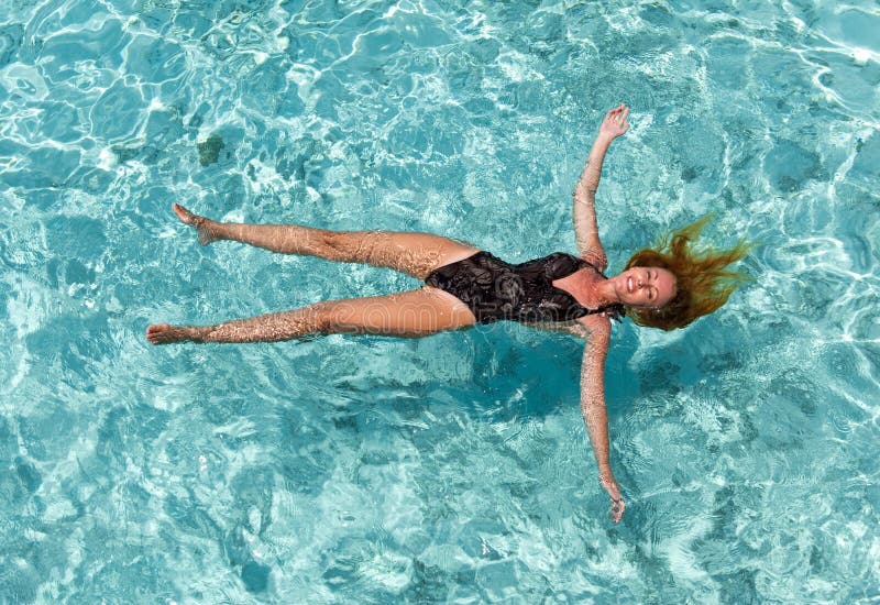 The Woman in a Black Bathing Suit Swims in the Sea Stock Image Image
