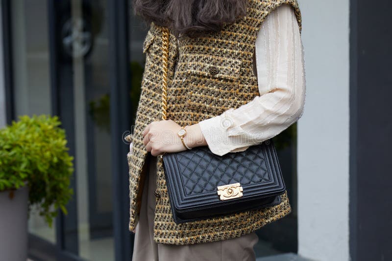 Woman with Black Chanel Leather Bag and Brown and Yellow Jacket before Fila  Fashion Show, Milan Editorial Image - Image of outfit, chanel: 194199990