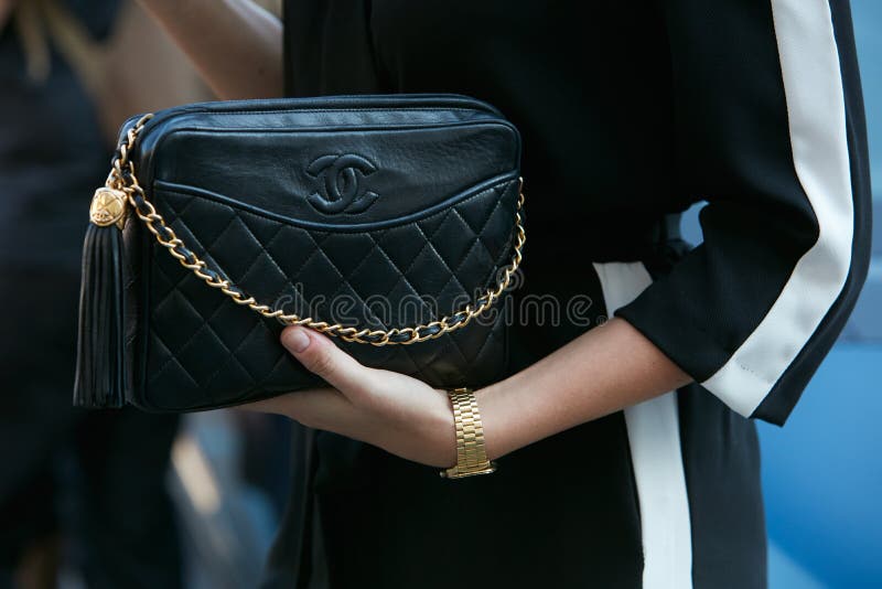 Authentic Black Chanel Bag Sitting on Table Editorial Image