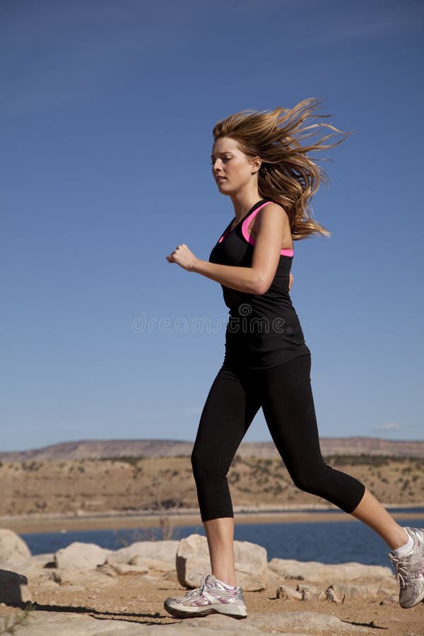 Woman black clothes run wind hair