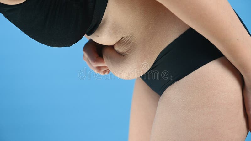 Woman in Black Underwear Holds Her Belly Fat. Thick Folds on Female Stomach  Body Control, Diet and Weight Loss Concept Stock Image - Image of obesity,  corpulent: 216308299
