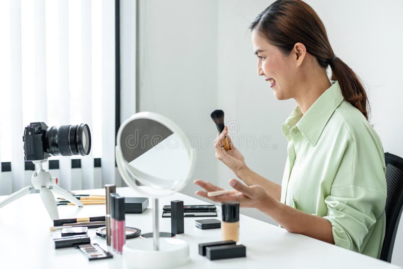 Woman blogger is present make up tutorial beauty cosmetic review product and broadcast live streaming video to teaching online on stock images