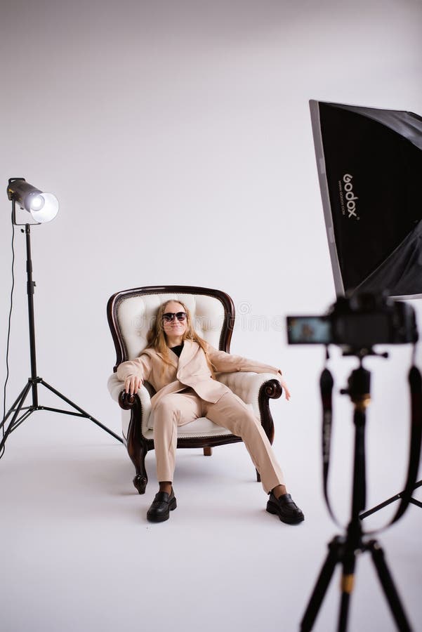 Woman blonde blogger in white photo studio stock images