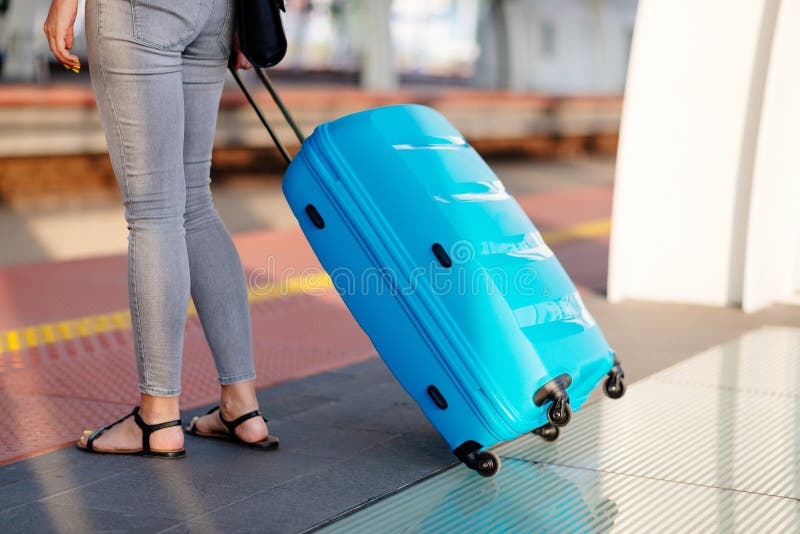 Woman with blue baggage suitcase royalty free stock image Woman with blue baggage suitcase royalty free stock image