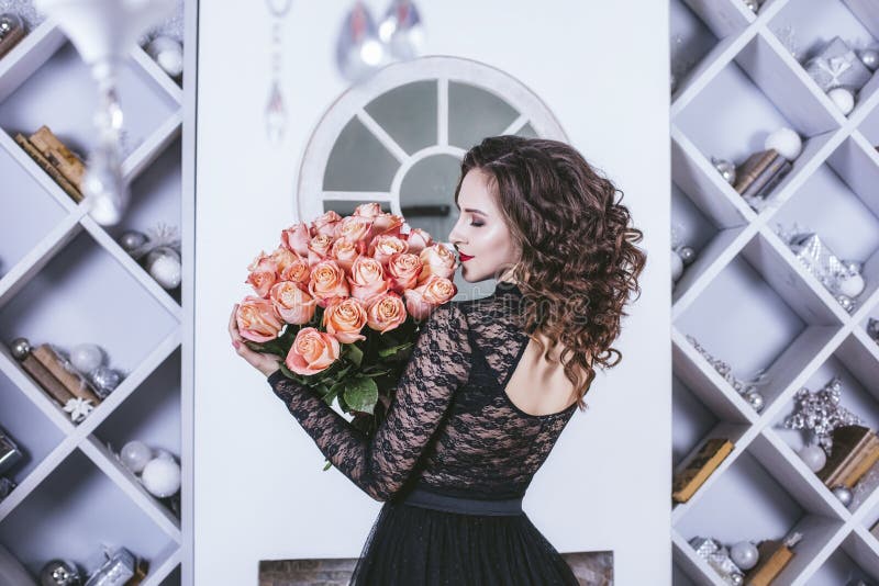 Woman with bouquet of flowers roses beautiful and happy modern i stock photos Woman with bouquet of flowers roses beautiful and happy modern i stock photos