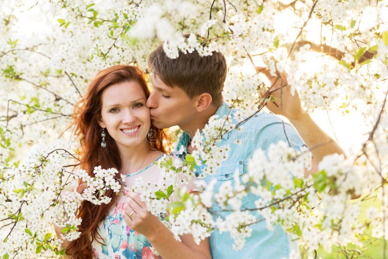 清春　L (c/w KISS IN THE FLOWER) Man and Woman Kissing in Flower Garden Stock Image - Image of