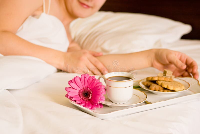 Woman with breakfast in bed