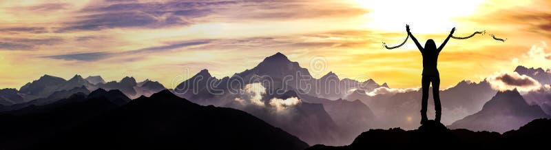 Woman breaks her chains on a mountain peak