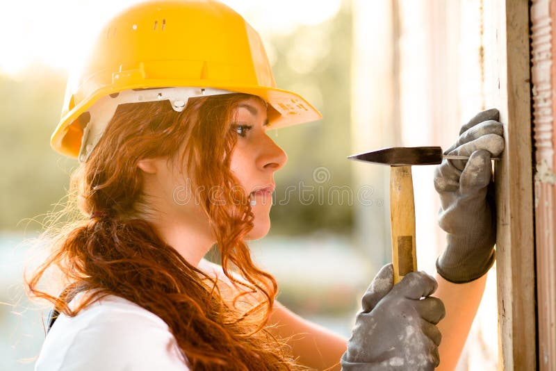 Woman Bricklayer with Hammer royalty free stock images