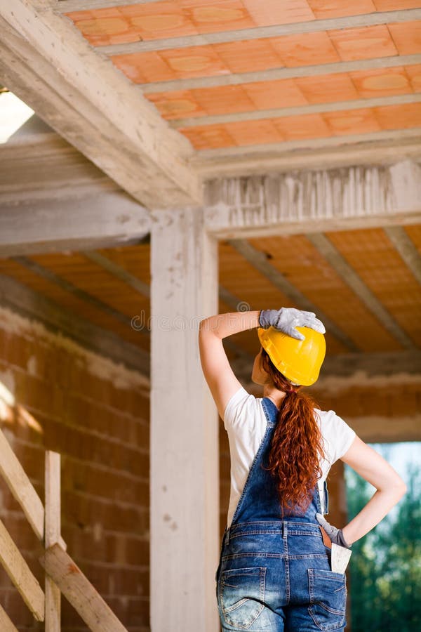 Woman Bricklayer Watching Upstairs royalty free stock images