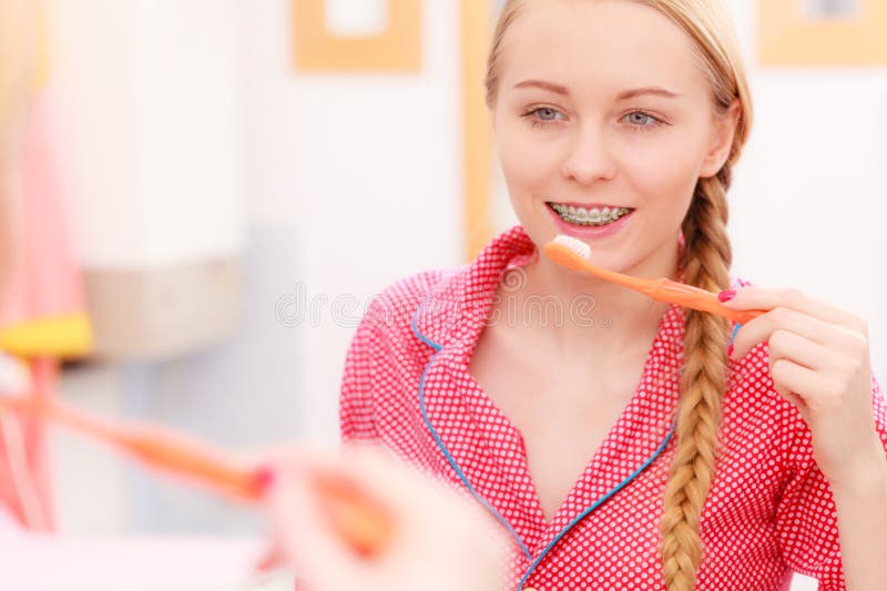 Woman brushing cleaning teeth in bathroom royalty free stock photos Woman brushing cleaning teeth in bathroom royalty free stock photos