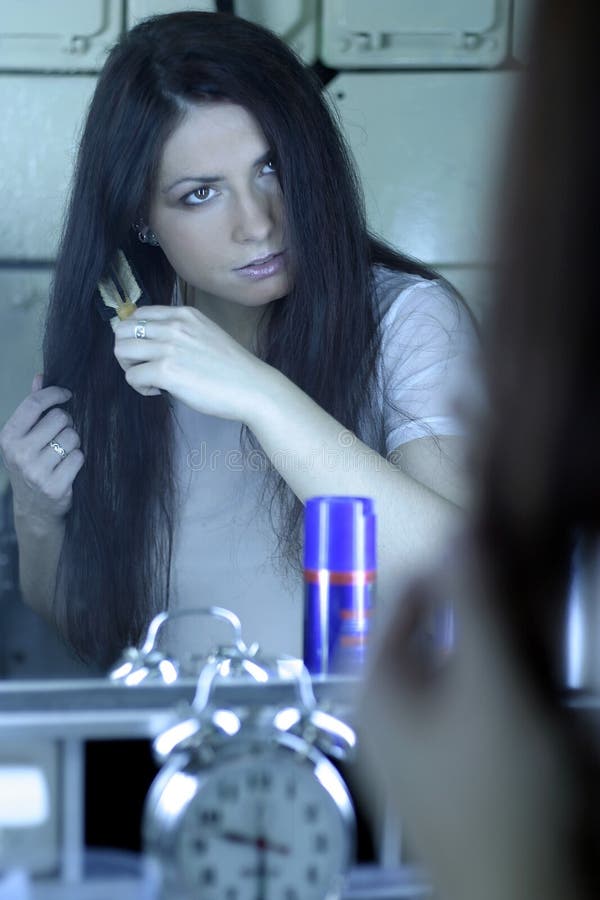 Woman brushing hair