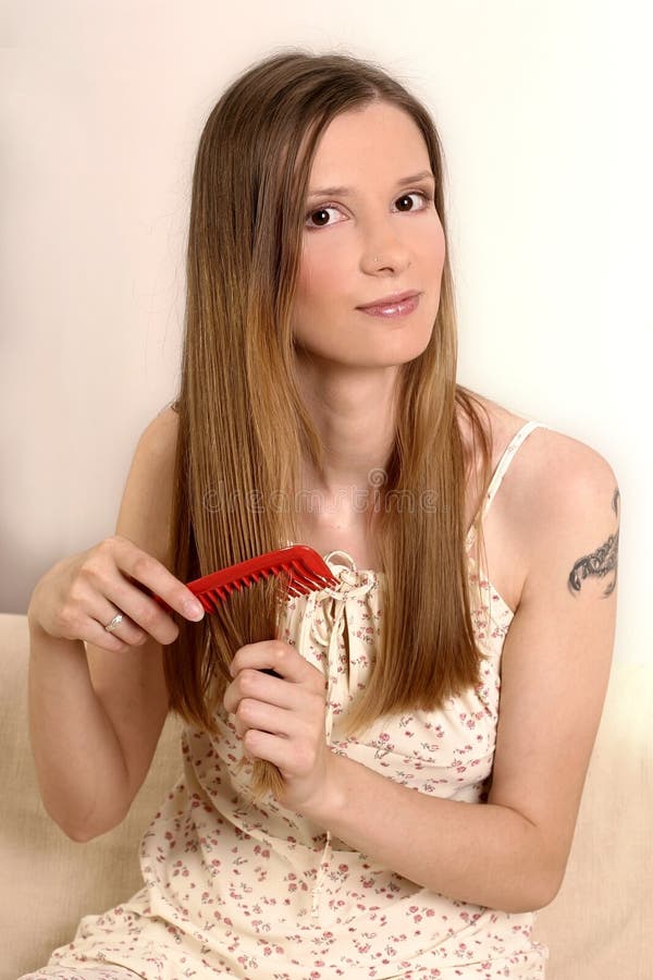 Woman brushing hair stock photo. Image of portrait, look 1291394