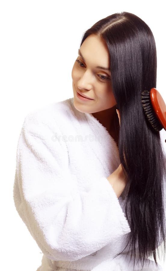 Woman brushing her hair stock image. Image of hairbrush - 13932767