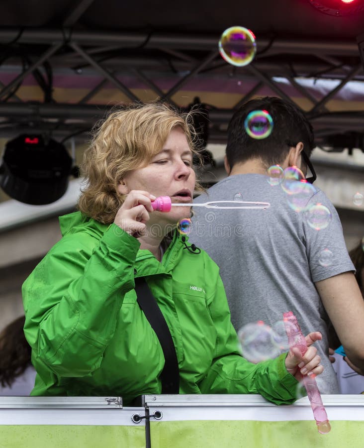 A Woman with a Bubble Blower on a Float Attending the Gay Pride Parade