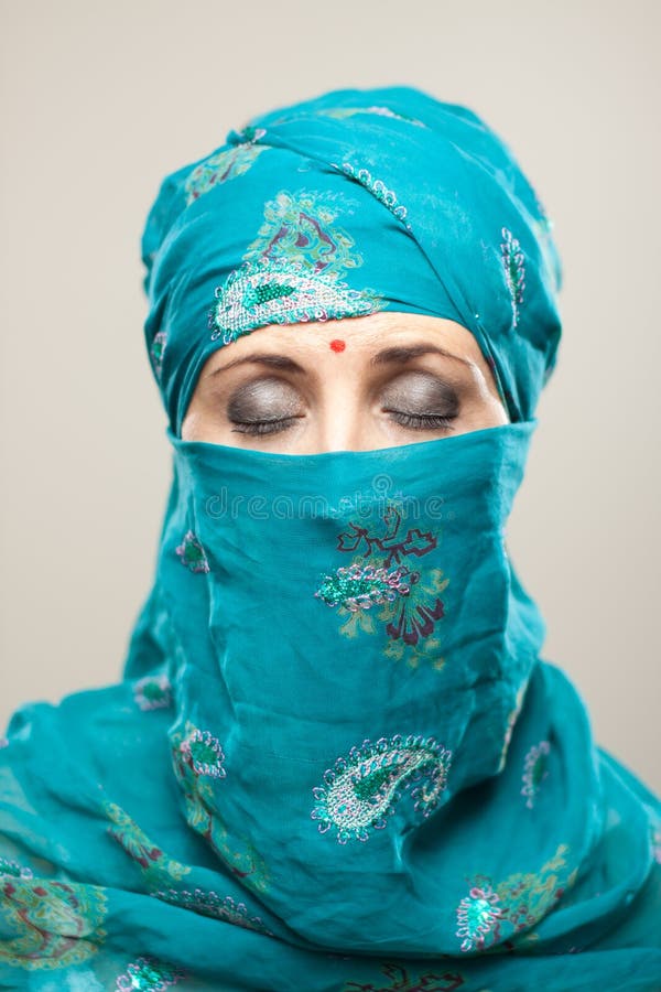 Woman in burqa with makeup