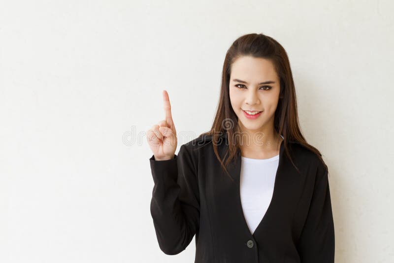 Woman business executive showing 1 or one finger hand gesture