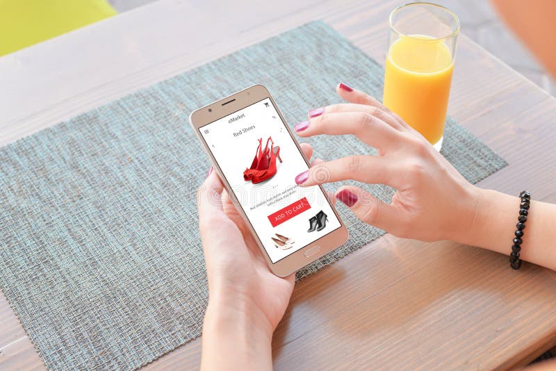 Woman buy red shoes online . Mobile app or web site on screen