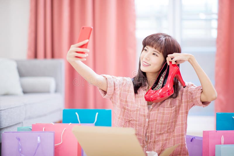 Woman buy shoes on internet royalty free stock photography Woman buy shoes on internet royalty free stock photography