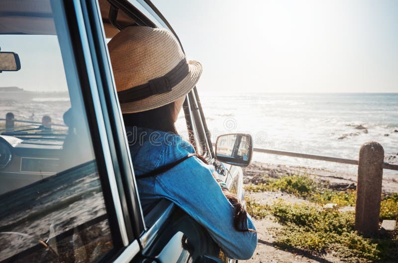 Woman, car and travel with scenery of ocean on promenade for adventure, fresh air and holiday with mockup. Person, relax royalty free stock photo