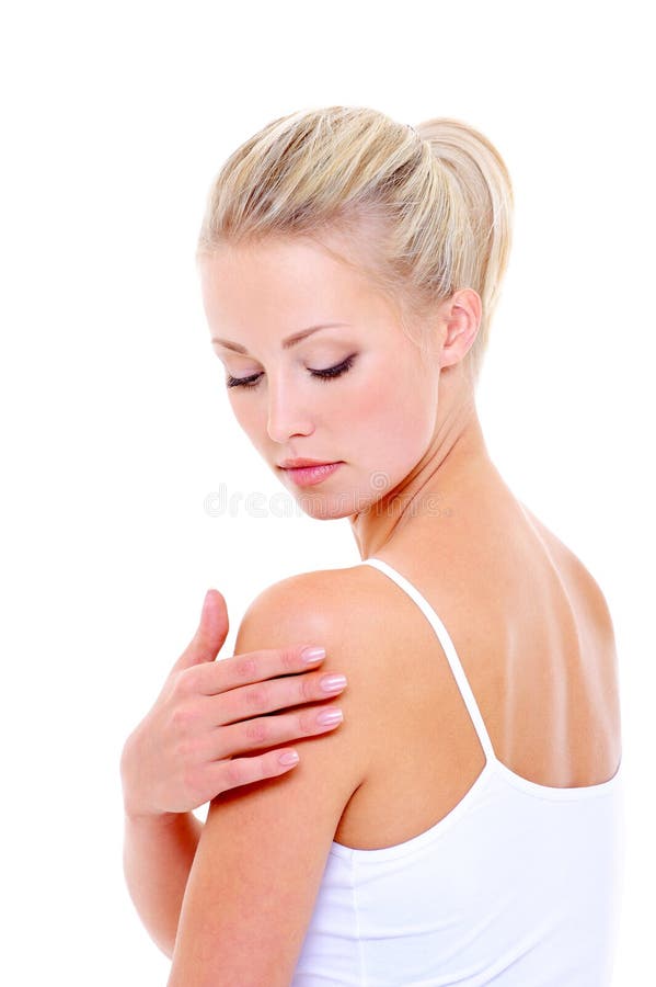 Woman care massaging her shoulder over white background