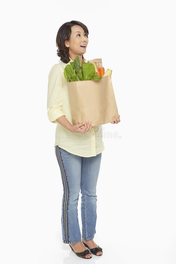 Woman Carrying a Bag of Groceries Stock Image Image of adults, full
