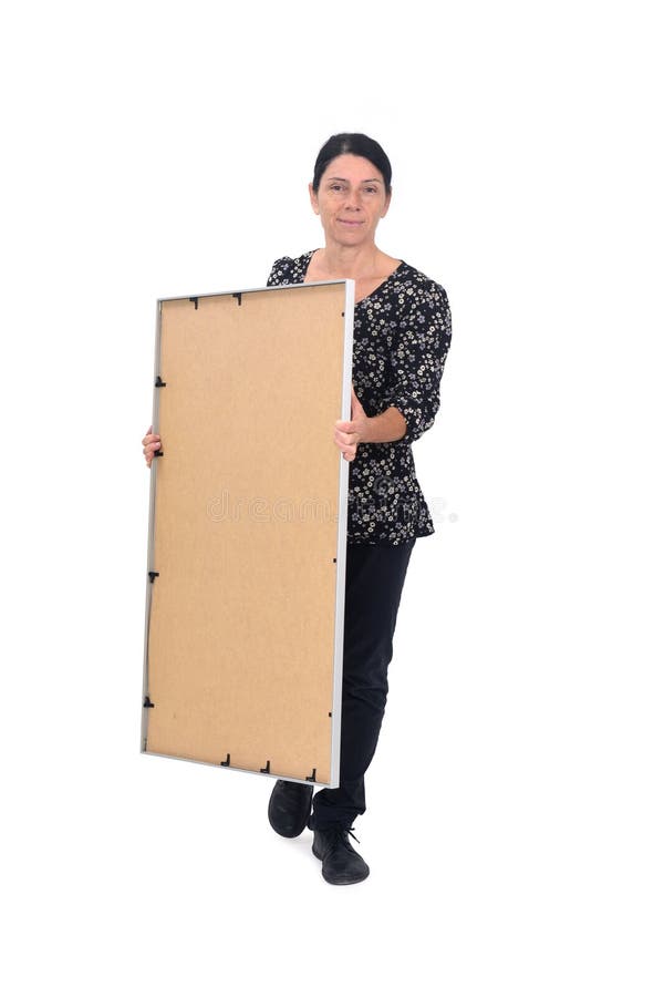 Woman carrying objects on white background. front view of a woman carrying a frame on white background