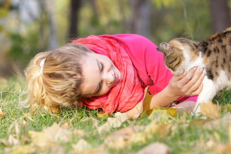 Woman with cat outdoors