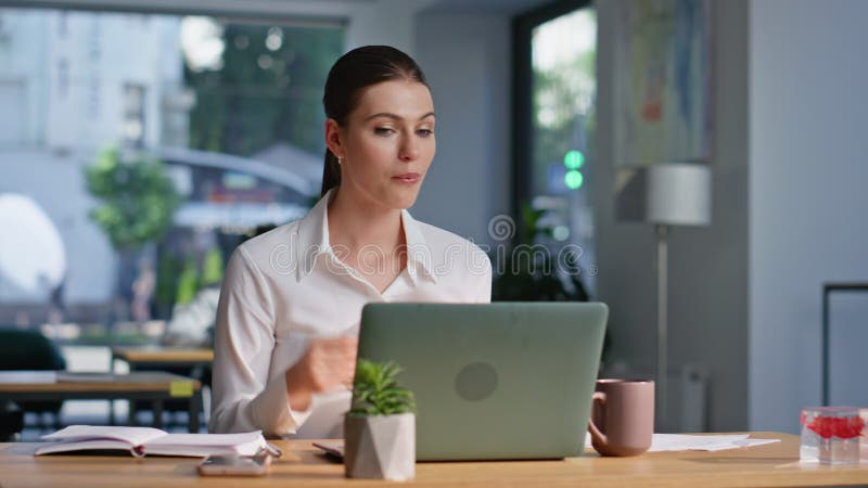 Woman ceo complaining video call showing papers to laptop webcam closeup. royalty free stock photo