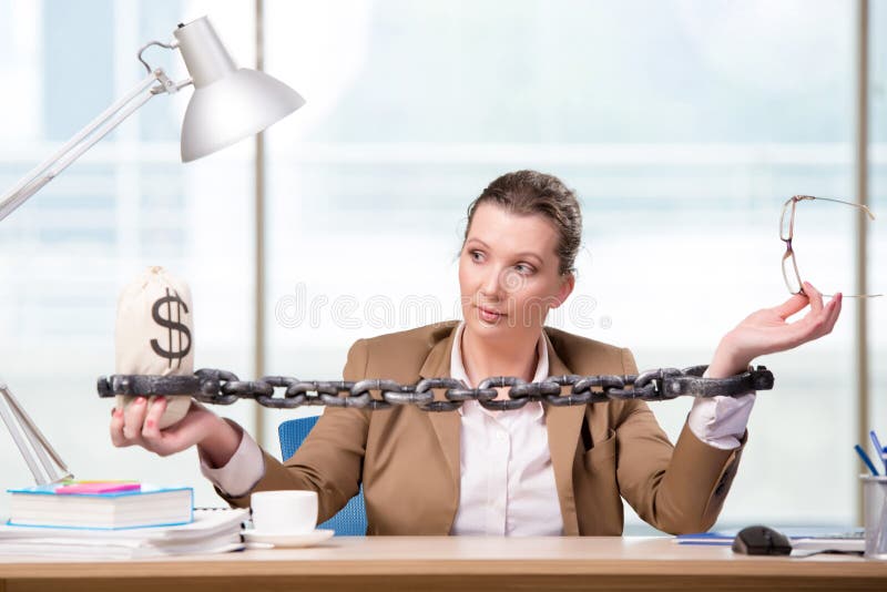 The woman chained to her working desk. Office, computer.