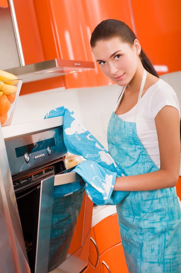 Woman checking how her cookies in the oven