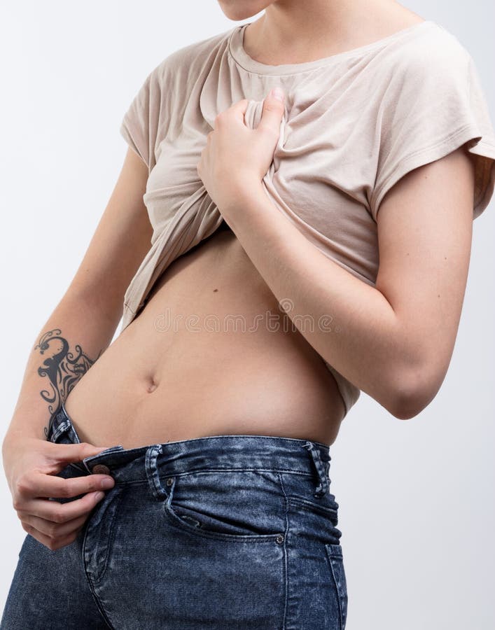 beautiful slim girl with flat belly in sexual casual clothes Stock Photo