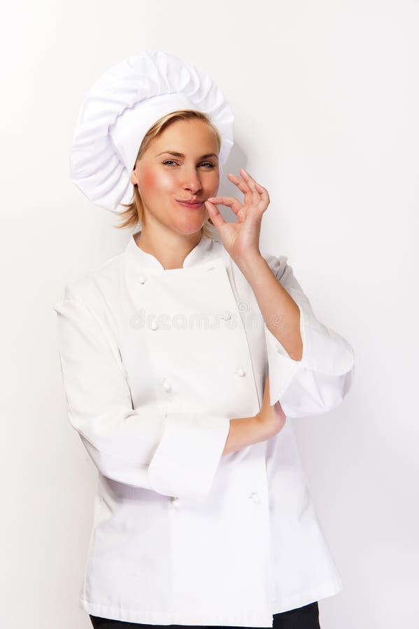 Woman chef in cook outfit showing perfect sign and smiling at ca