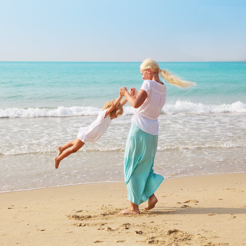 Mother and Son on the Beach Stock Photo - Image of leisure, adult: 69421978