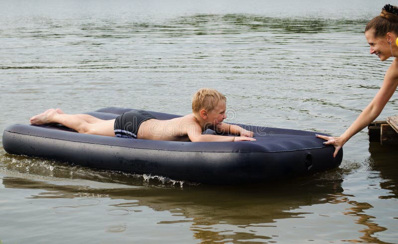 The woman and the child on an inflatable mattress
