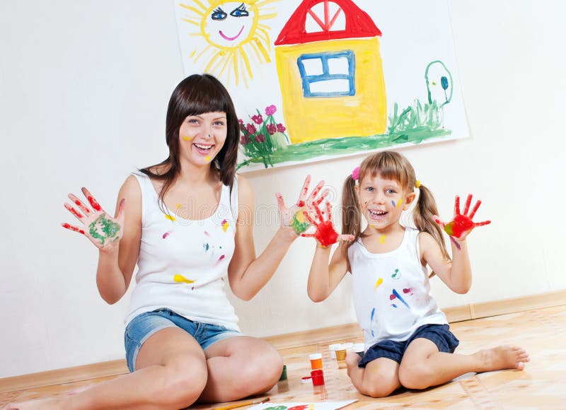 Woman and child paint colors royalty free stock photos