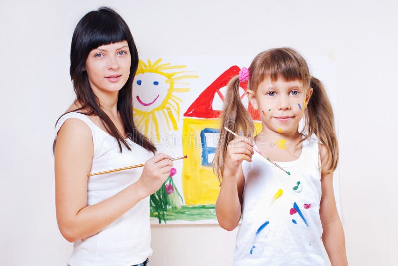 Woman and child paint colors stock photos