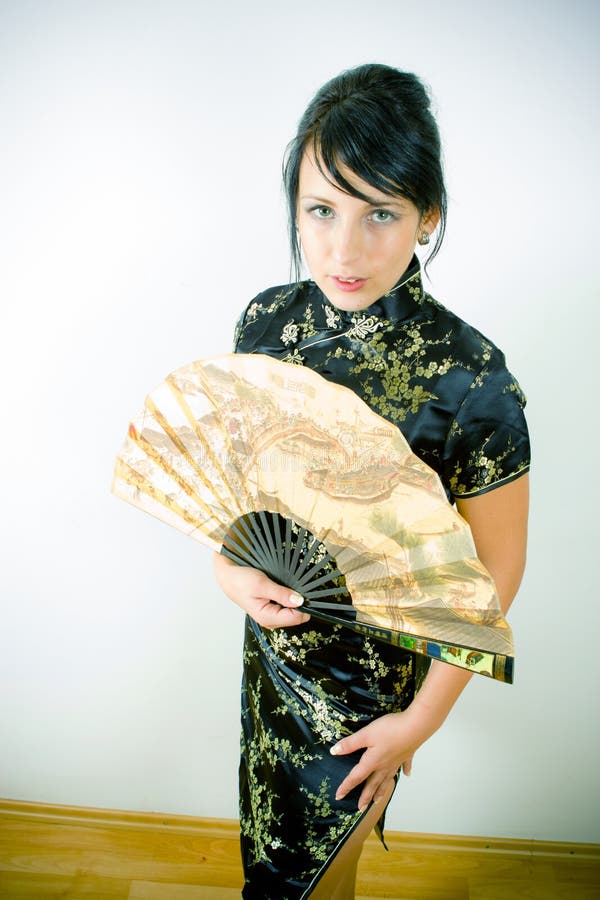 Woman in Chinese dress with fan