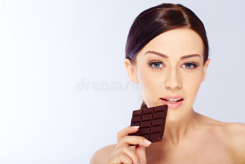 Woman with a Chocolate in Hand Stock Photo Image of beautiful, slim