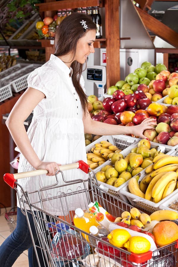 Woman choose food in grocery supermarket
