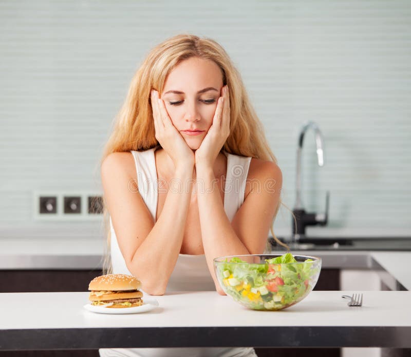 Woman Chooses between a Healthy and Unhealthy Food Stock Image - Image ...