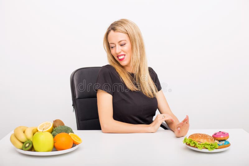 Woman choosing to eat healthy royalty free stock image Woman choosing to eat healthy royalty free stock image
