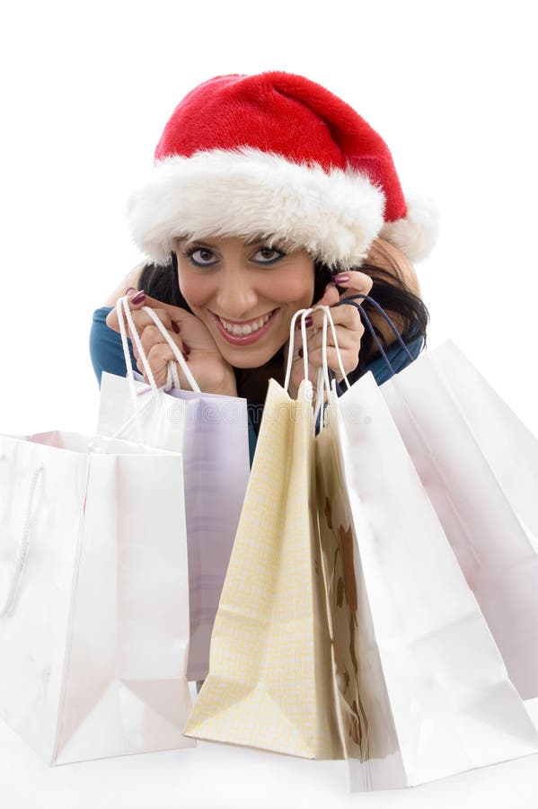 Woman with christmas hat and shopping bags