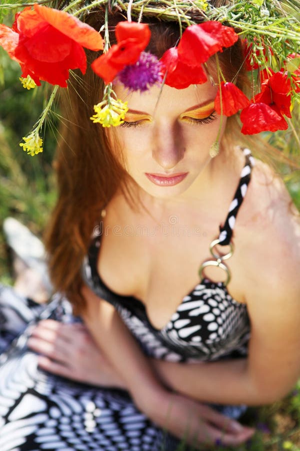 Woman and circlet of flowers