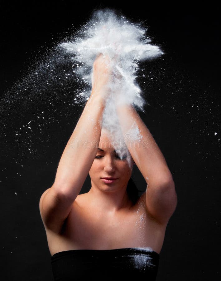 Woman Clapping Flour Between Hands Over Head