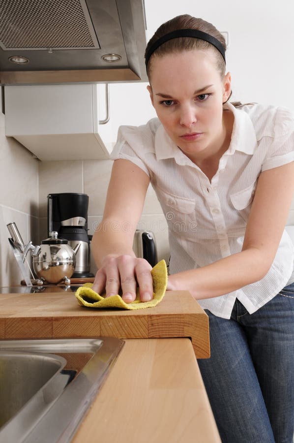 Woman cleaning the kitchen