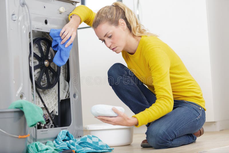 Woman cleaning a leak royalty free stock images Woman cleaning a leak royalty free stock images