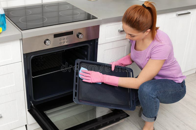 Woman Cleaning Oven Tray with Rag Stock Image Image of door, clean