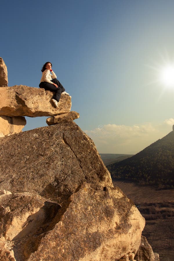 Woman on cliff s edge